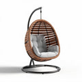 Hanging egg chair with cushioned seating and metal frame in brown and gray